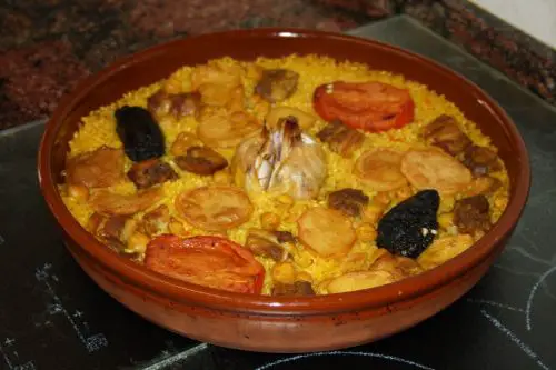 Baked paella in a clay casserole