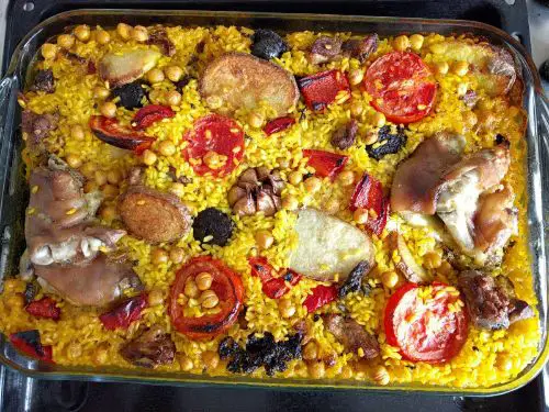 Baked paella in a glass casserole